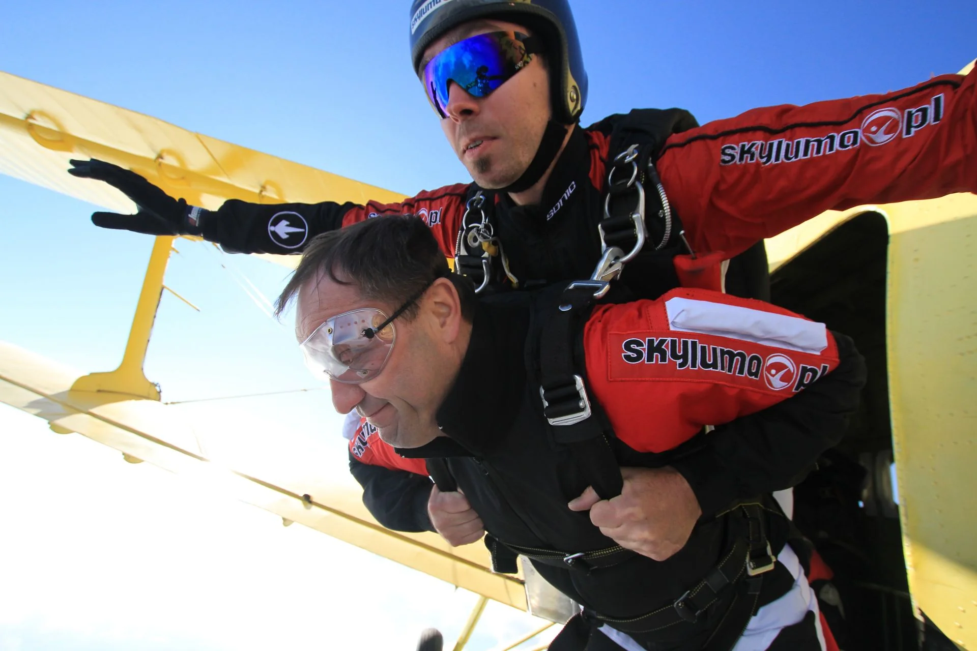 Instructor and passenger a heartbeat after exit, still beside the plane